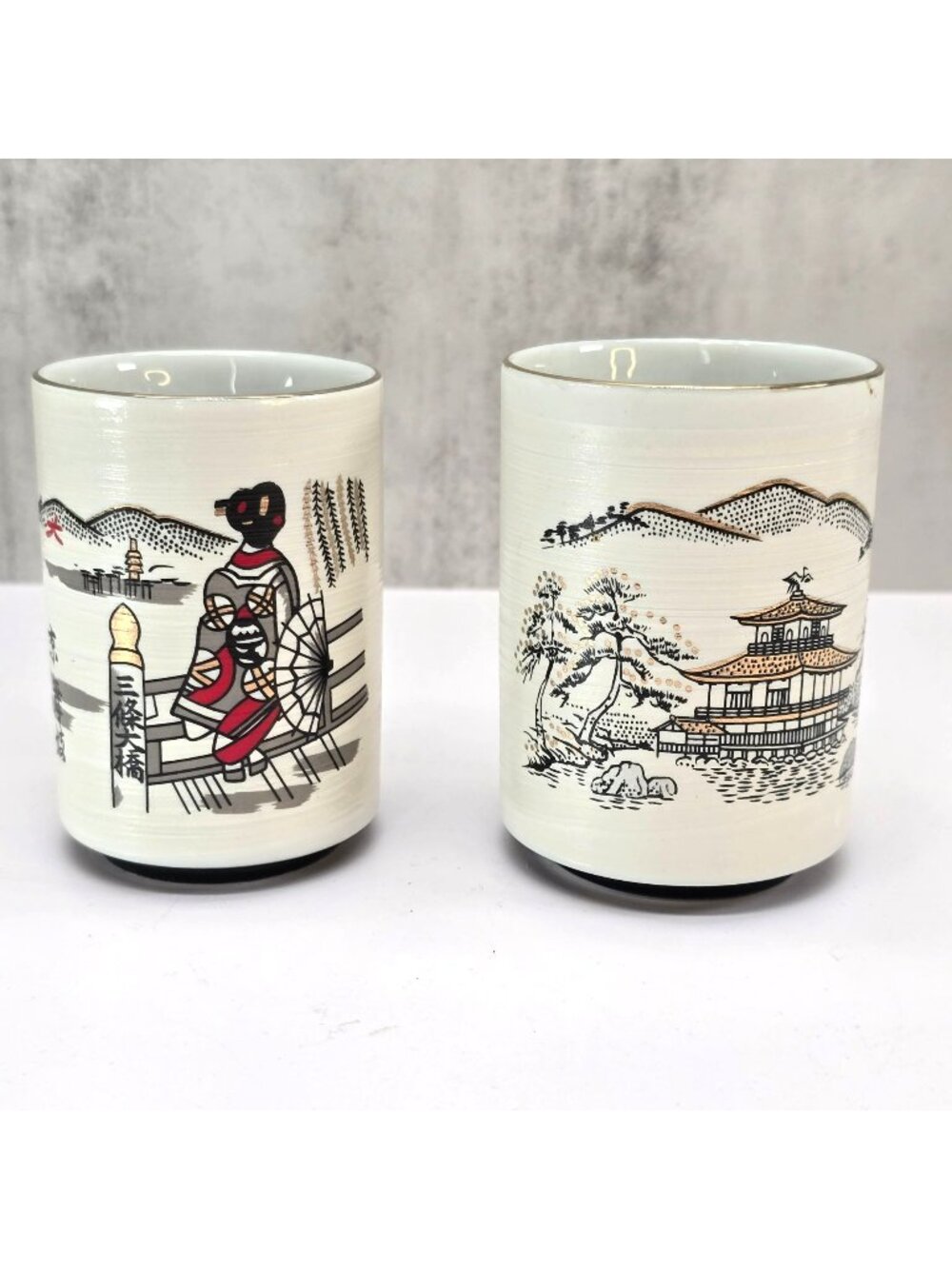 Japanese Ceramic Tea Cups Set Of 2 With Scenic Geisha & Pagoda Designs VL5093